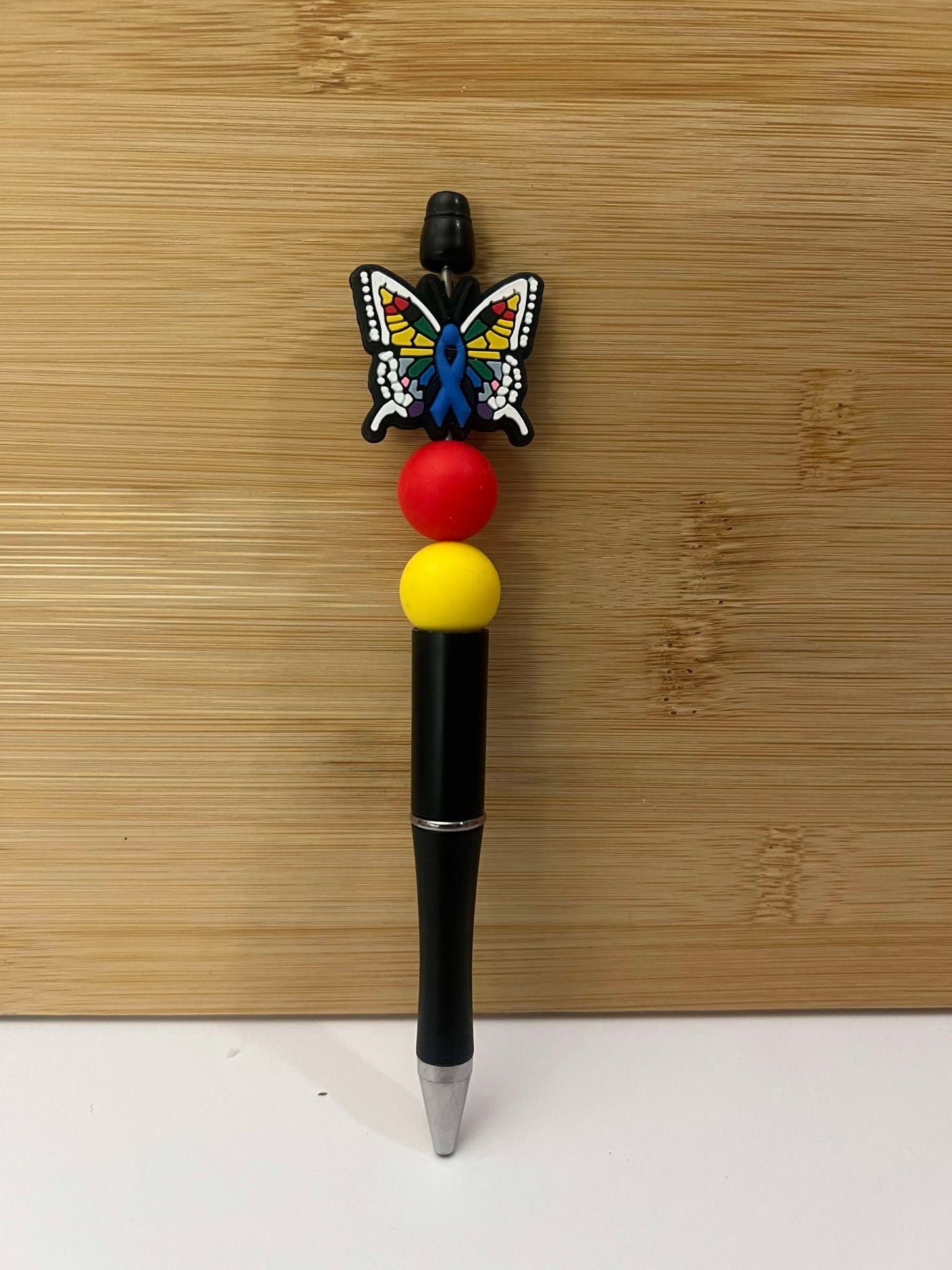 Rainbow Mosaic Butterfly, black. - Pen