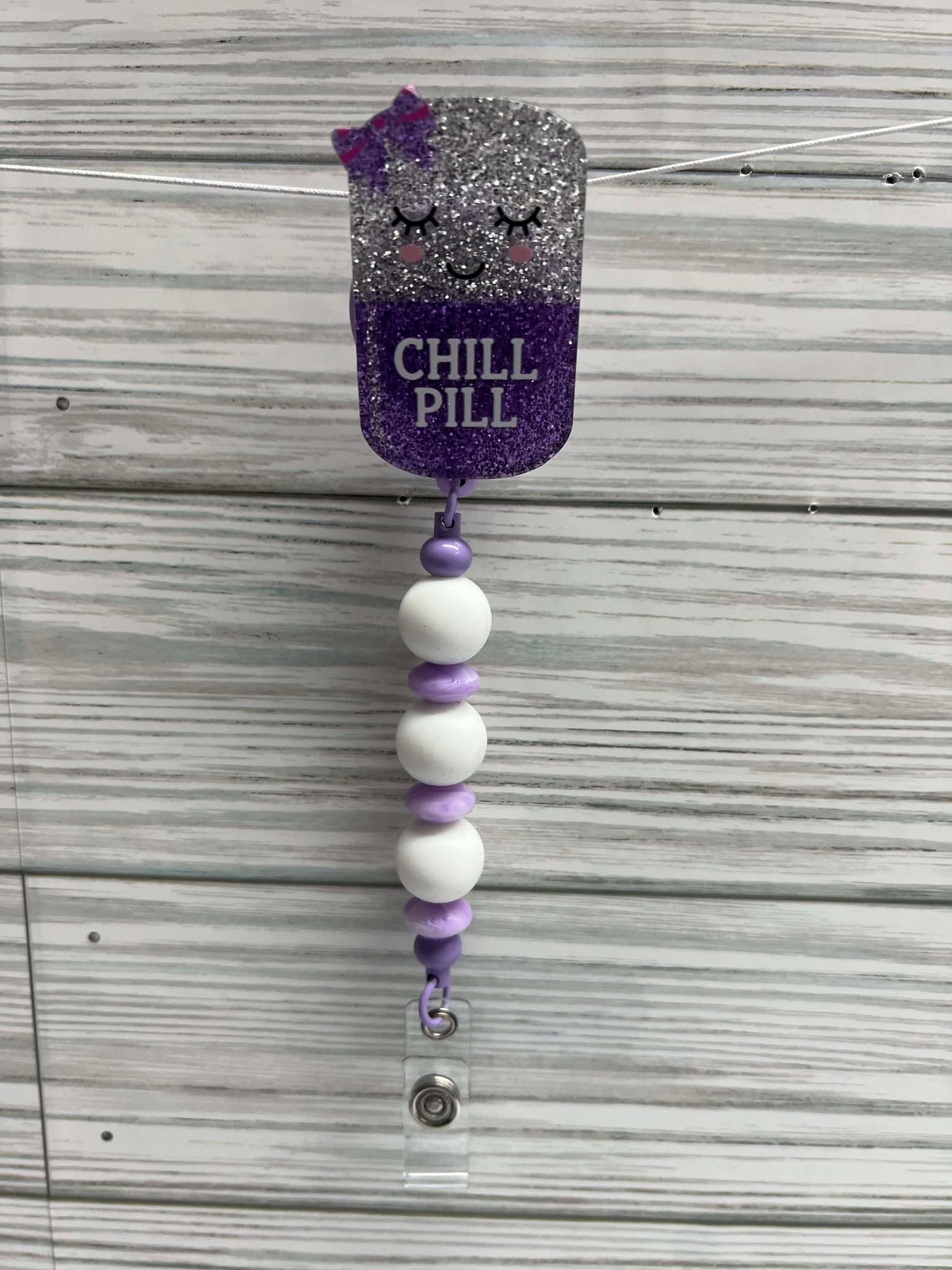 Chill Pill purple and white - badge reel