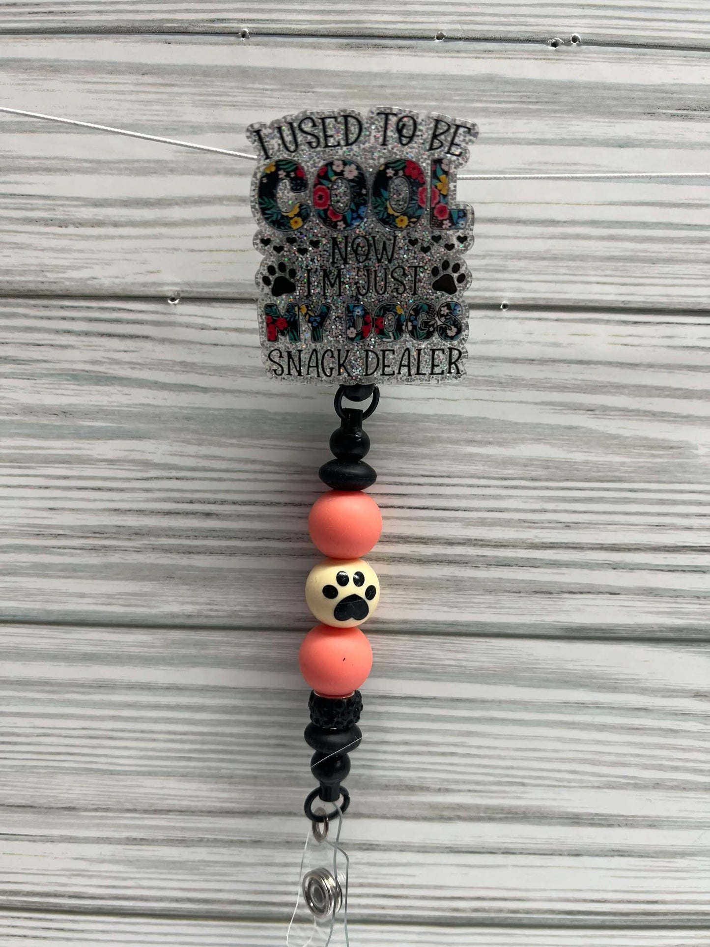 I used to be cool, Now I'm just my dogs snack dealer orange - Badge reel