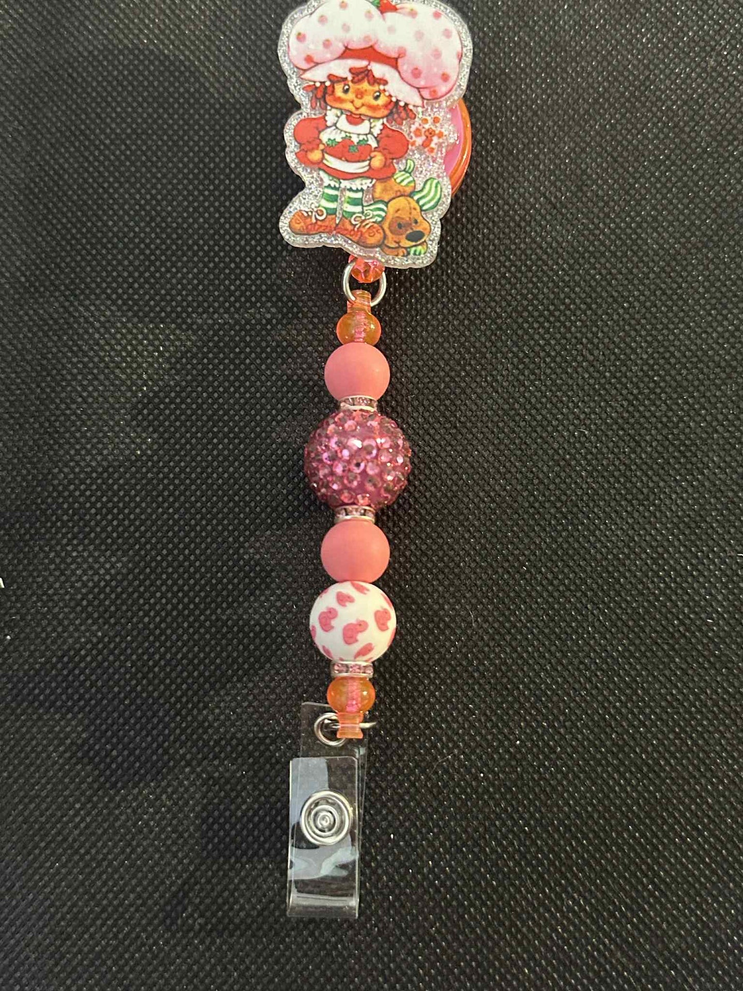 pink doll Badge Reel