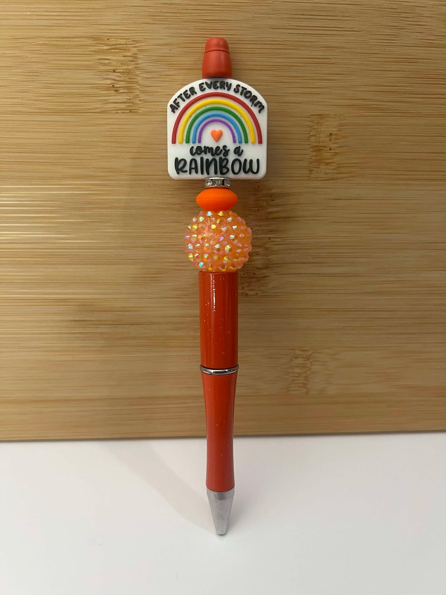After every storm, comes a rainbow, red. - Pen