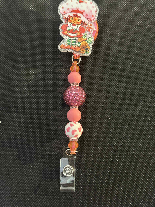 pink doll Badge Reel